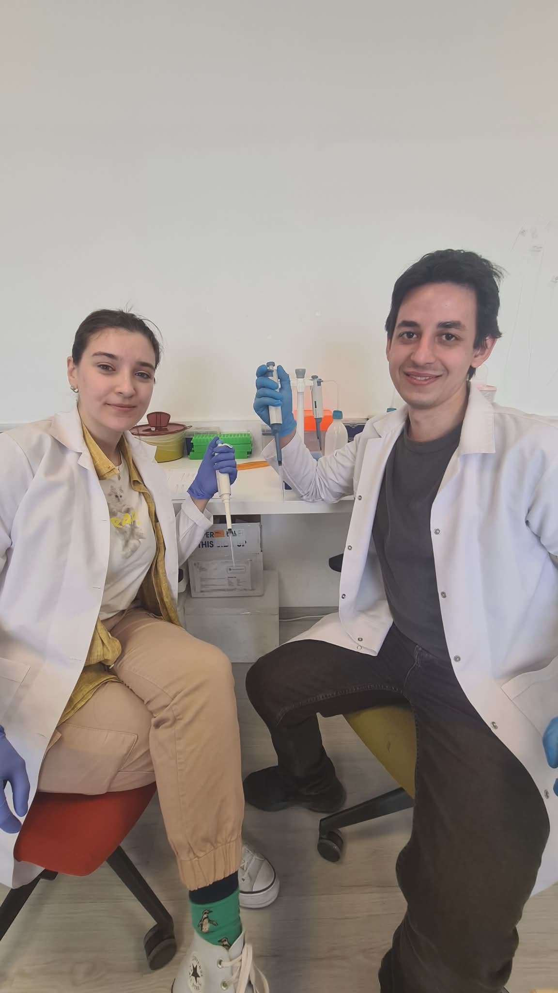 Whally lab team with pipettes